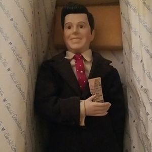 Ricky Ricardo porcelain doll with vintage newspape